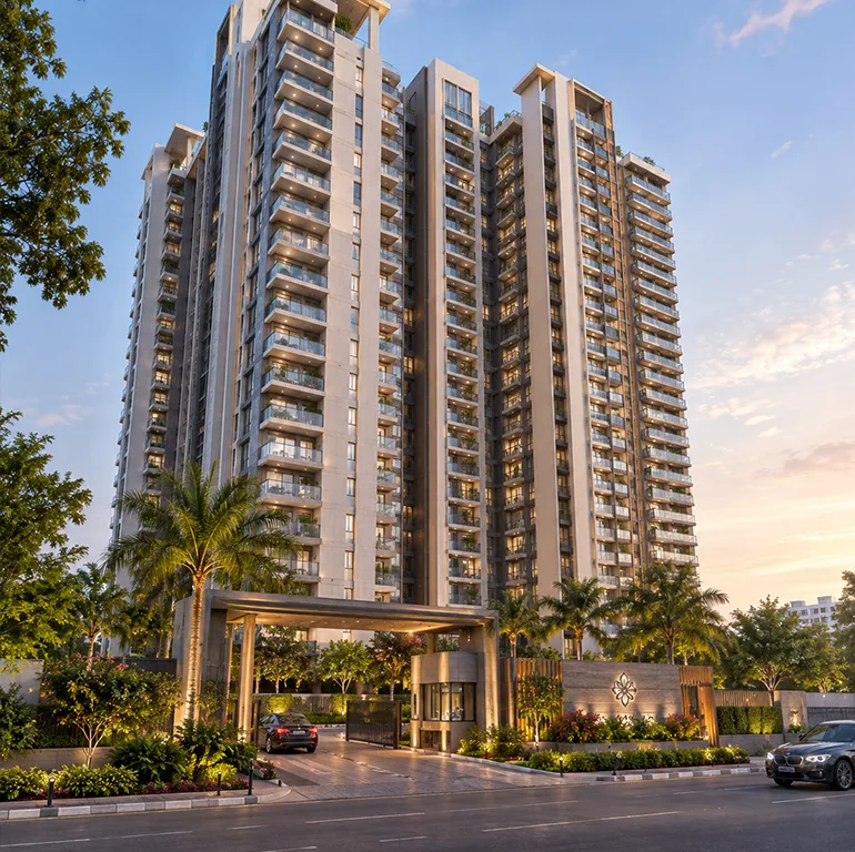 Experion One 42 tower entrance at dusk with a covered arrival porch and lit landscaped forecourt